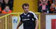 Dundee FC footballer pictured playing with electronic tag on his ankle