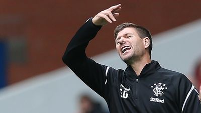 Steven Gerrard watches yet another Rangers player get sent off