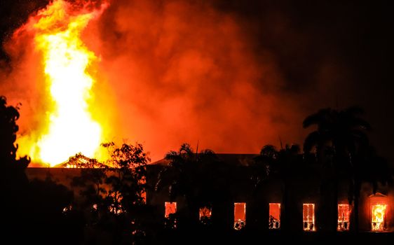 RIO DE JANEIRO, BRAZIL - SEPTEMBER 02: A fire burns at the National Museum of Brazil on September 2, 2018 in Rio de Janeiro, Brazil. The museum, which is tied to the Rio de Janeiro federal university and the Education Ministry, was founded in 1818 by King John VI of Portugal. It houses several landmark collections including Egyptian artefacts and the oldest human fossil found in Brazil. Its collection include more than 20 million items ranging from archaeological findings to historical memorabilia. (Photo by Buda Mendes/Getty Images)