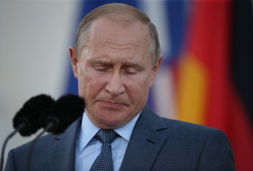 GRANSEE, GERMANY - AUGUST 18: Russian President Vladimir Putin and German Chancellor Angela Merkel (not pictured) give statements to the media prior to talks at Schloss Meseberg palace, the German government retreat, at Meseberg on August 18, 2018 near Gransee, Germany. The two leaders are meeting to dicuss a variety of issues, including the current international sanctions imposed on Russia, the situation in Syria as well as the situation in eastern Ukraine. (Photo by Sean Gallup/Getty Images)