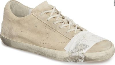 £335 pair of shoes comes with free tape and dog s**t stains