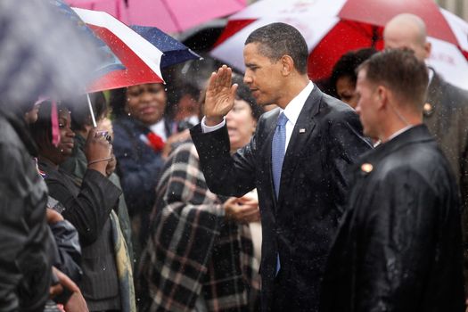 ARLINGTON, VA - SEPTEMBER 11: In the driving rain, U.S. President Barack Obama salutes to family members of victims of the 9/11 attack during a rememberance ceremony at the Pentagon September 11, 2009 in Arlington, Virginia. Obama joined staff and family members at the Pentagon to comemorate the eighth anniversary of the September 11 attacks. (Photo by Chip Somodevilla/Getty Images)