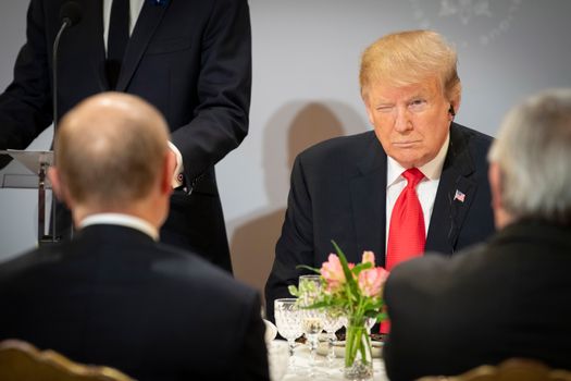 PARIS, FRANCE - NOVEMBER 11: In this handout photo provided by the German Government Press Office (BPA), US President Donald Trump sits opposite Russian President Vladimir Putin during lunch at the Elysee Palace during the occasion of the commemoration ceremony of the 100th anniversary since the end of The First World War on November 11, 2018 in Paris, France. Heads of State from around the world gather in Paris to commemorate the end of the First World War (WWI). The armistice ending the First World War between the Allies and Germany was signed at Compiègne, France on eleventh hour of the eleventh day of the eleventh month - 11am on the 11th November 1918. (Photo by Guido Bergmann/Bundesregierung via Getty Images) French Army