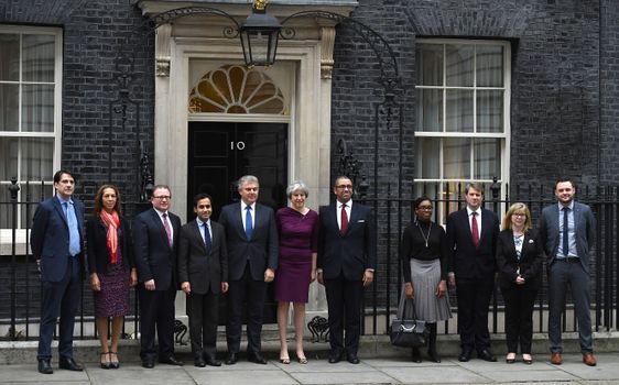 LONDON, ENGLAND - JANUARY 08: (L to R) James Morris (Vice Chair, Training and Development ), Helen Grant (Vice Chair, Diverse Communities ), Marcus Jones (Vice Chair Local Government), Rehman Chishti (Vice Chair, Diverse Communities), Brandon Lewis (Chair), Prime Minister Theresa May, James Cleverly (Deputy Chair), Kemi Badenoch (Vice Chair for Candidates), Chris Skidmore (Vice Chair, Policy), Maria Caulfield (Vice Chair for Women), Ben Bradley (Vice Chair for Youth) pose outside 10 Downing Street as the Prime Minister Reshuffles her cabinet on January 8, 2018 in London, England. Today's Cabinet reshuffle is Theresa May's third since becoming Prime Minister in July 2016 and was triggered after she sacked first secretary of state and close friend Damian Green before Christmas. (Photo by Leon Neal/Getty Images)