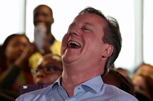 LONDON, ENGLAND - MAY 5: Prime Minister David Cameron laughs as London Mayor Boris Johnson speaks during an election rally on May 5, 2015 in Hendon, London, United Kingdom. Britain will go to the polls in a national election in just two days time. (Photo by Toby Melville - WPA Pool /Getty Images)