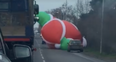 Gigantic inflatable Santa goes rogue and holds up traffic