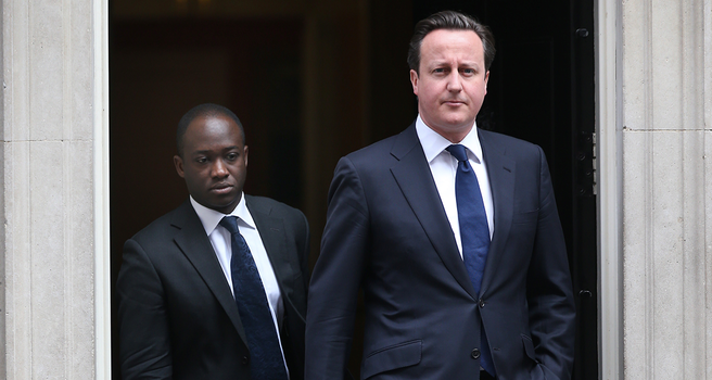 LONDON, UNITED KINGDOM - APRIL 10: Prime Minister David Cameron (R) leaves Downing Street with his Parliamentary Private Secretary Sam Gyimah on April 10, 2013 in London, England. Parliament has been recalled today to allow MPs and Peers to pay their respects to former Prime Minister Lady Thatcher who died on April 8, 2013. (Photo by Peter Macdiarmid/Getty Images)