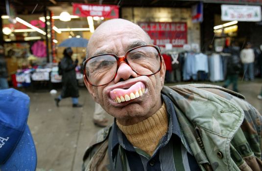 NEW YORK - JANUARY 6: Israel de Jesus shows off his false teeth while watching the 26th Annual Three Kings Day Parade January 6, 2003 in New York City. The parade celebrates the Feast of the Epiphany, also known as Three Kings Day, marking the Biblical story of the visit of three kings to Bethlehem to visit the baby Jesus. (Photo by Mario Tama/Getty Images)