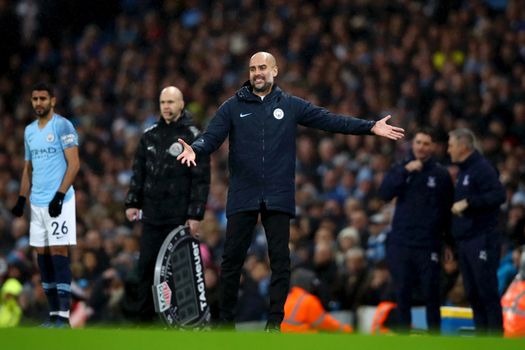 MANCHESTER, ENGLAND - DECEMBER 22: Josep Guardiola, Manager of Manchester City reacts during the Premier League match between Manchester City and Crystal Palace at Etihad Stadium on December 22, 2018 in Manchester, United Kingdom. (Photo by Clive Brunskill/Getty Images)