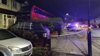 Double-decker bus smashes into garden of London home causing Boxing Day chaos