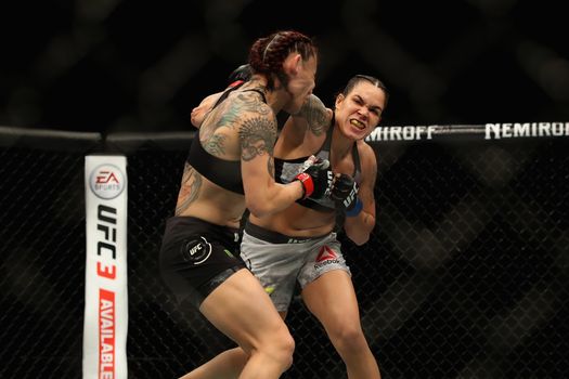 INGLEWOOD, CA - DECEMBER 29: Cris Cyborg of Brazil (left) is punched by Amanda Nunes (right) during a Women's Feather weight bout during the UFC 232 event inside The Forum on December 29, 2018 in Inglewood, California. (Photo by Sean M. Haffey/Getty Images)