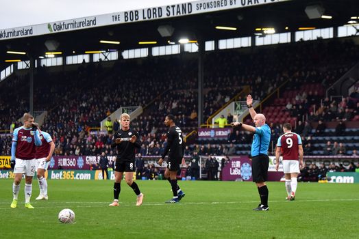 BURNLEY, ENGLAND - JANUARY 05: Referee Simon Hooper overturns a penalty decision following a VAR check during the FA Cup Third Round match between Burnley and Barnsley at Turf Moor on January 5, 2019 in Burnley, United Kingdom. (Photo by Nathan Stirk/Getty Images)