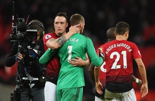 LONDON, ENGLAND - JANUARY 13: Phil Jones of Manchester United congratulates David De Gea after the Premier League match between Tottenham Hotspur and Manchester United at Wembley Stadium on January 13, 2019 in London, United Kingdom. (Photo by Mike Hewitt/Getty Images)