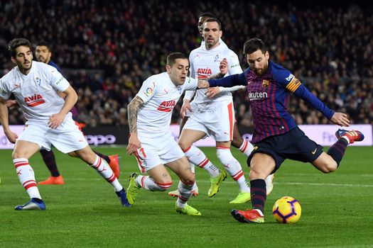 BARCELONA, SPAIN - JANUARY 13: Lionel Messi of FC Barcelona scores his team's second goal during the La Liga match between FC Barcelona and SD Eibar at Camp Nou on January 13, 2019 in Barcelona, Spain. The goal is Messi's 400th goal in La Liga for FC Barcelona. (Photo by David Ramos/Getty Images)