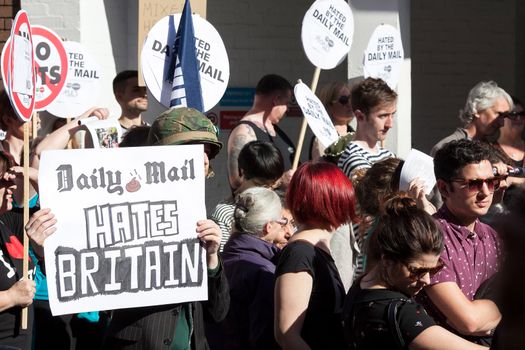 LONDON, ENGLAND - OCTOBER 06: Protesters gather outside the head offices of the Daily Mail on October 6, 2013 in London, England. The protest, which was organised by the People's Assembly Against Austerity, aims to condemn a perceived 'campaign of hatred' they claim is being pushed by the paper in the wake of the Ralph Miliband affair. (Photo by Dan Dennison/Getty Images)