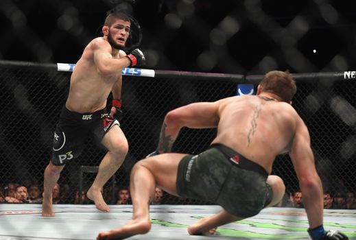 LAS VEGAS, NV - OCTOBER 06: Khabib Nurmagomedov of Russia (L) chases down Conor McGregor of Ireland in their UFC lightweight championship bout during the UFC 229 event inside T-Mobile Arena on October 6, 2018 in Las Vegas, Nevada. (Photo by Harry How/Getty Images)