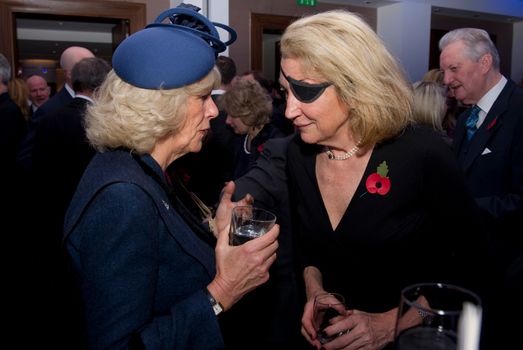 LONDON - NOVEMBER 10: Camilla, Duchess of Cornwall (L), speaks with Marie Colvin of The Sunday Times (R) during a service at St. Bride's Church November 10, 2010 in London, England. The service commemorated journalists, cameramen and support staff who have fallen in the war zones and conflicts of the past decade. (Photo by Arthur Edwards - WPA Pool/Getty Images)