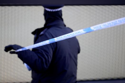 LONDON, ENGLAND - APRIL 05: A police officer marks a corden near the scene where a man, aged 20, collapsed after being fatally stabbed last night near Link Street, Hackney, on April 5, 2018 in London, England. The man approached police officers and was given first aid at the scene but later died. The latest killing takes the total to over 50 violent deaths in London since the begining of 2018. (Photo by Christopher Furlong/Getty Images)