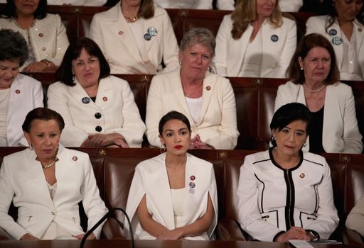 WASHINGTON, DC - FEBRUARY 05: Rep. Alexandria Ocasio-Cortez (D-NY) watches President Donald Trump's State of the Union address in the chamber of the U.S. House of Representatives at the U.S. Capitol Building on February 5, 2019 in Washington, DC. A group of female Democratic lawmakers chose to wear white to the speech in solidarity with women and a nod to the suffragette movement. (Photo by Alex Wong/Getty Images)