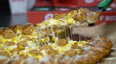 KFC and Pizza Hut team up for a gravy and Popcorn Chicken pizza