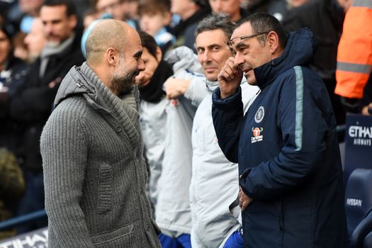 MANCHESTER, ENGLAND - FEBRUARY 10: Maurizio Sarri, Manager of Chelsea speaks to Josep Guardiola, Manager of Manchester City prior to the Premier League match between Manchester City and Chelsea FC at Etihad Stadium on February 10, 2019 in Manchester, United Kingdom. (Photo by Michael Regan/Getty Images)