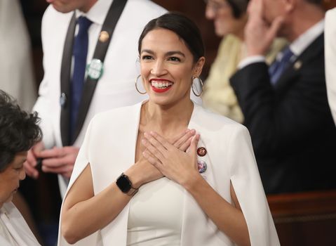 WASHINGTON, DC - FEBRUARY 05: U.S. Rep. Alexandria Ocasio-Cortez (D-NY) greets fellow lawmakers ahead of the State of the Union address in the chamber of the U.S. House of Representatives on February 5, 2019 in Washington, DC. President Trump's second State of the Union address was postponed one week due to the partial government shutdown. (Photo by Win McNamee/Getty Images)