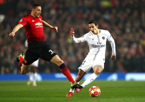 MANCHESTER, ENGLAND - FEBRUARY 12: Angel Di Maria of PSG is tackled by Nemanja Matic of Manchester United during the UEFA Champions League Round of 16 First Leg match between Manchester United and Paris Saint-Germain at Old Trafford on February 12, 2019 in Manchester, England. (Photo by Michael Steele/Getty Images)