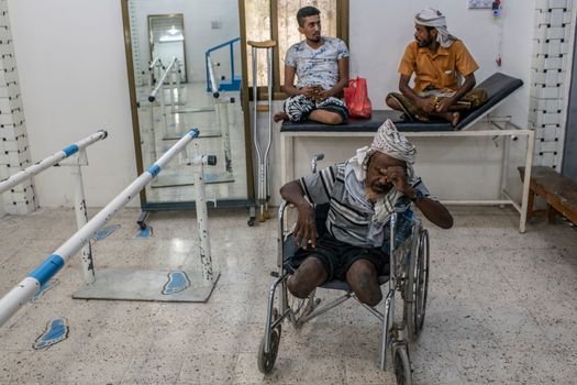 ADEN, YEMEN - SEPTEMBER 24: Aish Abduallah Jaber al-Abri, 55, waits to be fitted for a set of prosthetic limbs at a government health clinic on September 24, 2018 in Aden, Yemen. Jaber al Abri stepped on a landmine in Al Khawkhah and has waited two years to be fitted for a pair of prothetic legs. A coalition military campaign has moved west along Yemen's coast toward Hodeidah, where increasingly bloody battles have killed hundreds since June, putting the country's fragile food supply at risk. (Photo by Andrew Renneisen/Getty Images)