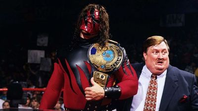 WWE wrestler Kane dresses up as The Cat In The Hat to read to some presumably terrified kids