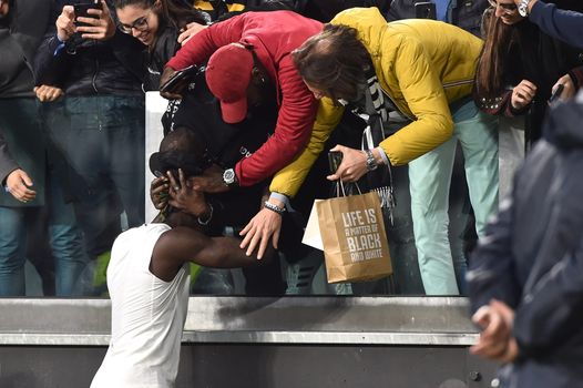 Moise Kean celebrates with Juventus fans after scoring the winner against AC Milan