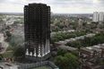 Man charged over video showing burning effigy of Grenfell Tower