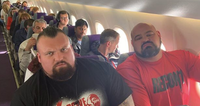 Eddie Hall and Brian Shaw on a plane.