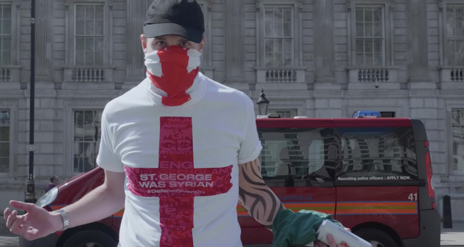 A protester at a far-right demonstration wears a St Geroge's Day t-shirt that reads 'St George was Syrian'