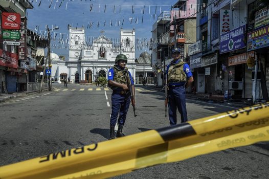 Security personnal at St Anthony's Church on April 24, 2019 in Colombo, Sri Lanka. At least 321 people were killed and 500 people injured after coordinated attacks on churches and hotels on Easter Sunday which rocked three churches and three luxury hotels in and around Colombo as well as at Batticaloa in Sri Lanka. According to reports, the Islamic State group have claimed responsibility on Tuesday for the attacks while investigations show the attacks were carried out in retaliation for the Christchurch mosque shootings last month. Police have detained 40 suspects so far in connection with the suicide bombs while the country’s government blame the attacks on local Islamist group National Thowheed Jamath (NTJ). (Photo by Atul Loke/Getty Images)