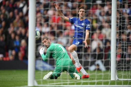 David De Gea of Manchester United looks on as he is beaten by Marcos Alonso of Chelsea as he scores his team's first goal during the Premier League match between Manchester United and Chelsea FC at Old Trafford on April 28, 2019 in Manchester, United Kingdom. (Photo by Shaun Botterill/Getty Images)