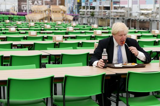 Boris Johnson eats a meal alone