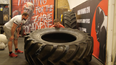 Flipping a 350 kilogram tyre with a top strongman