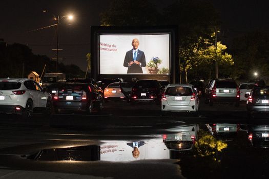 Barack Obama deliver his speech to the DNC, viewed from a drive-in theatre