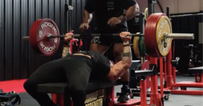 American breaks world bench press record in casual gym session