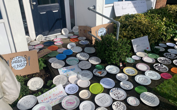 Empty plates left outside Tory office in protest of free school meals vote