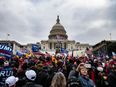 Woman shot, IED reportedly found at US Capitol after Trump supporters storm building