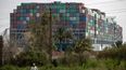 Tug boats honk horns in celebration after moving Suez Canal ship a few metres