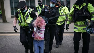 ‘Urgent review’ launched after woman left exposed during protest arrest