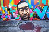 A George Floyd mural in Houston has been defaced with racial epiphets