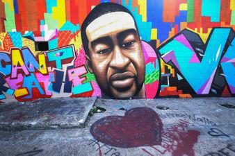 A George Floyd mural in Houston has been defaced with racial epiphets