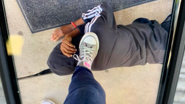 Teacher resigns after placing foot on Black student's neck