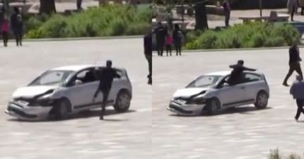 Man drop kicks through car window to save crowd from dangerous driver