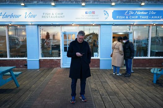 Keir Starmer stounds outside a fish and chip shop in Hartlepool while ccampaigning for the Labour party ahead of the upcoming by-election