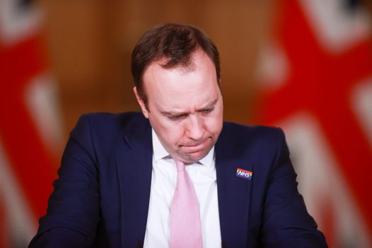 Matt Hancock grimaces during a downing street press conference.