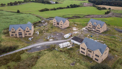 Five houses must be torn down after they were built a third bigger than planned